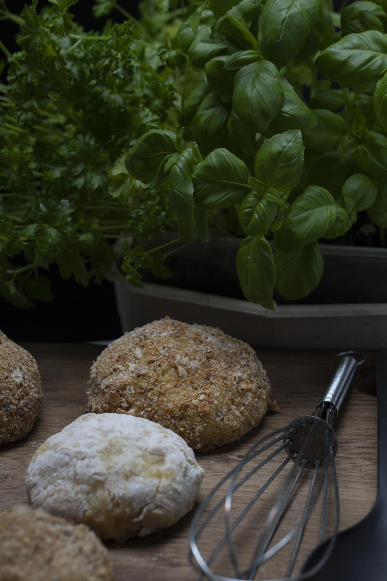 Rustic kitchen counter with pastries and herbs