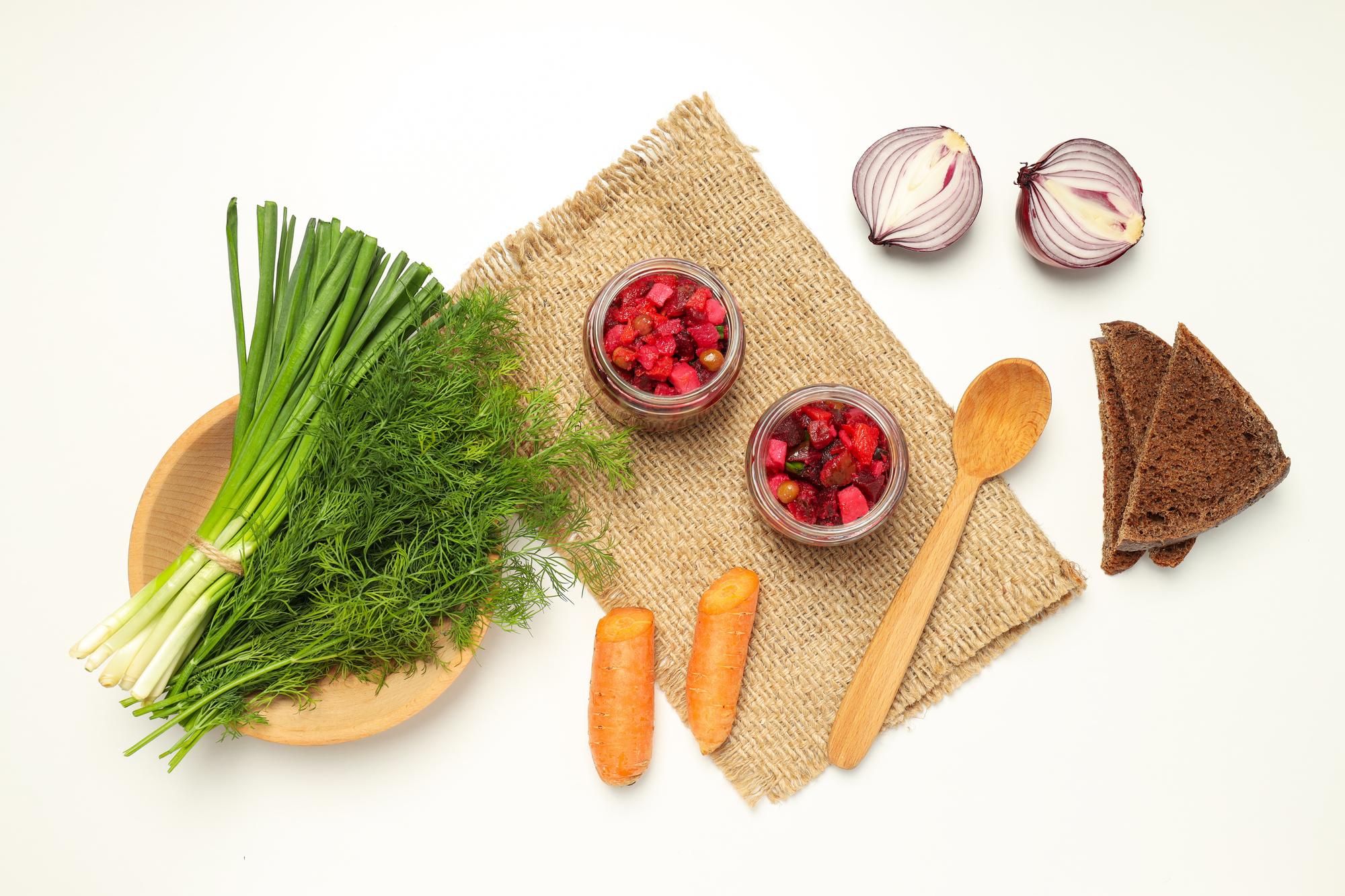 Seasonal vegetables and herbs on paper